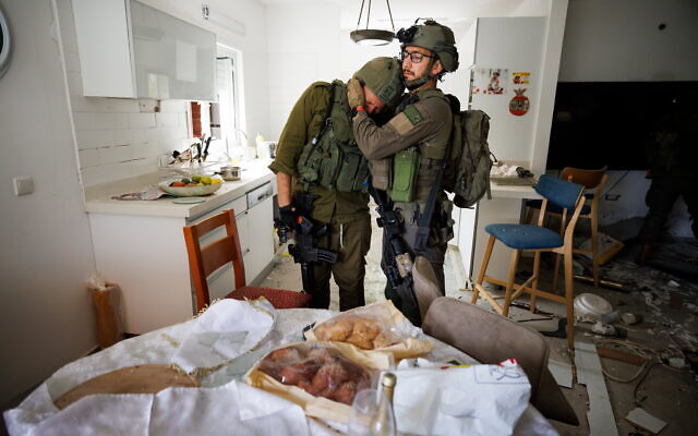 Reservist Yair Ansbacher can’t hold back tears in the sight of the holiday table for Simchat Torah // Photo Credit: Ziv Koren