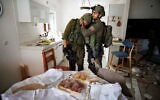 Reservist Yair Ansbacher can’t hold back tears in the sight of the holiday table for Simchat Torah // Photo Credit: Ziv Koren