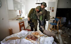 Reservist Yair Ansbacher can’t hold back tears in the sight of the holiday table for Simchat Torah // Photo Credit: Ziv Koren