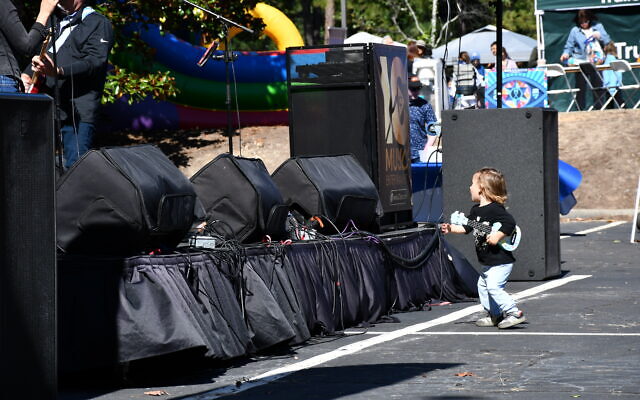 This young festival attendee was spotted enjoying the live music.