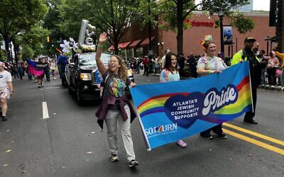 Jewish Atlanta community members are pictured marching in the parade.