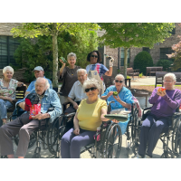 Residents at Berman Commons display some of the produce they grew in their Garden Club.