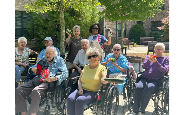 Residents at Berman Commons display some of the produce they grew in their Garden Club.