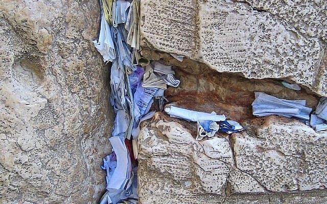 Prayers and notes in the cracks of the Western Wall (photo credit: CC-BY Yarin Kirchen/Wikipedia)