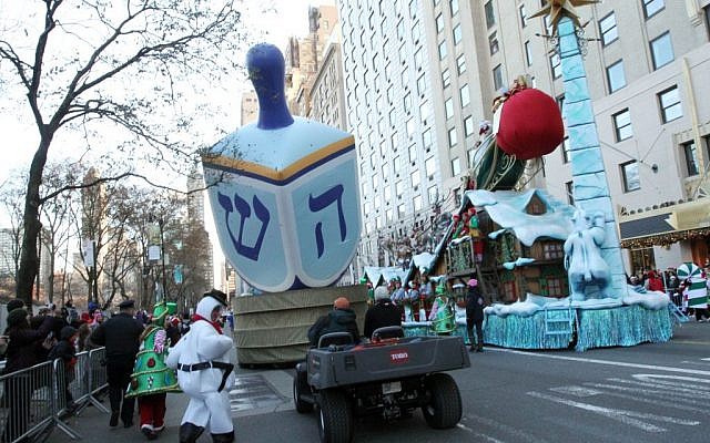 Illustrative: A dreidel balloon is paraded down Central Park South as part of the Macy's Thanksgiving Day Parade, November 28, 2013. (AP/Tina Fineberg)