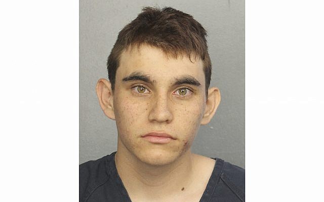This photo provided by the Broward County Jail shows Nikolas Cruz. Authorities say Cruz, a former student opened fire at Marjory Stoneman Douglas High School in Parkland, Fla., Wednesday, February 14, 2018, killing more than a dozen people and injuring several. (Broward County Jail via AP)