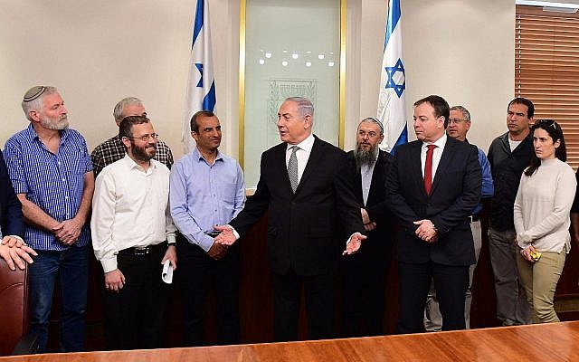 Prime Minister Benjamin Netanyahu (c) meets with settler leaders in his office on February 25, 2018. (Amos Ben Gershom/GPO)