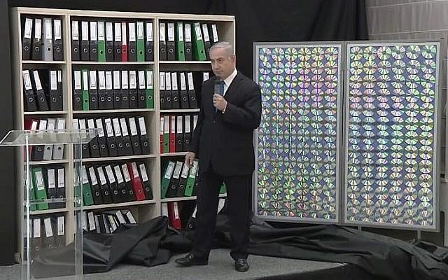 Prime Minister Benjamin Netanyahu gestures to Iranian nuclear files obtained by Israel which he says proves Iran lied about its nuclear weapons program, April 30, 2018 (Prime Minister's Office)