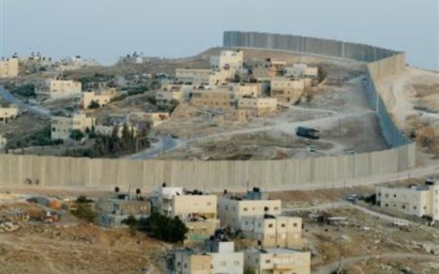 Separation Wall cutting through the village of Abu Dis, just outside Jerusalem.