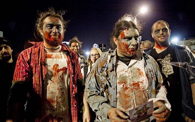 Dressed to thrill. Israelis participate the Zombue Walk in Tel Aviv on February 11, 2011. The Zombie Walk is held in tel Aviv just before the upcoming Purim Holiday in which Jews traditionaly wear costumes. (photo credit: Dima Vazinovich/Flash 90)