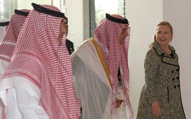 US Secretary of State Hillary Rodham Clinton, right, walks with Saudi Foreign Minister Prince Saud Al Faisal, center, after her meeting with King Abdullah of Saudi Arabia (photo credit: AP Photo)