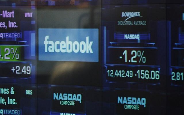 The Facebook logo appears on a display inside the NASDAQ Marketsite in Times Square. (photo credit: AP)