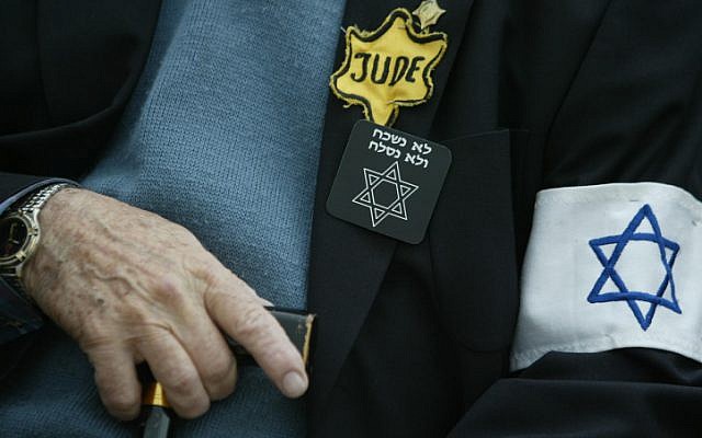 Illustrative photo of a Holocaust survivor attends a Holocaust Remembrance Day ceremony at Yad Vashem in Jerusalem. (Pierre Terdjman/Flash90)