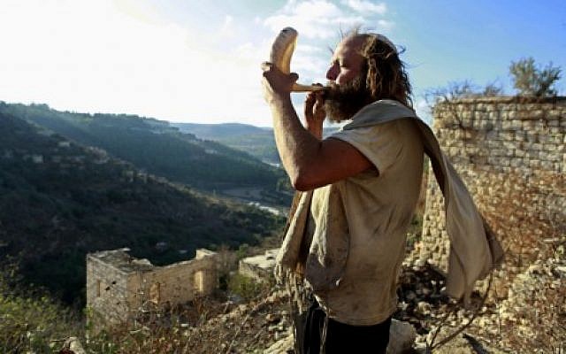 Who will live and who will die? Blowing the shofar in Lifta, near Jerusalem. (Uri Lenz/Flash90)