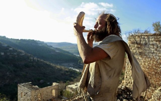 Blowing the shofar in the town of Lifta, near Jerusalem, September 2012. (Uri Lenz/ Flash90/ File)