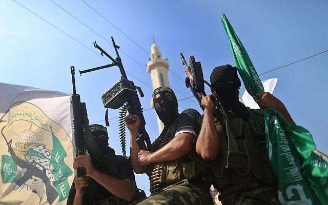 Hamas militants take part in a march in the streets of Gaza City to mark the first anniversary of the Shalit deal.  October 18, 2012 (photo credit: Wissam Nassar/Flash90)