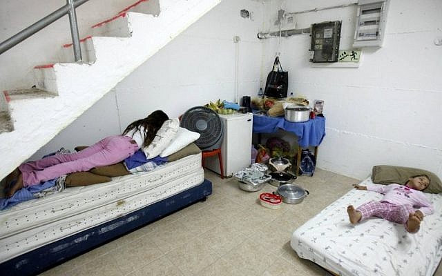 Israeli children sleeping in a bomb shelter in the southern city of Ashkelon (photo credit: Edi Israel/Flash90)