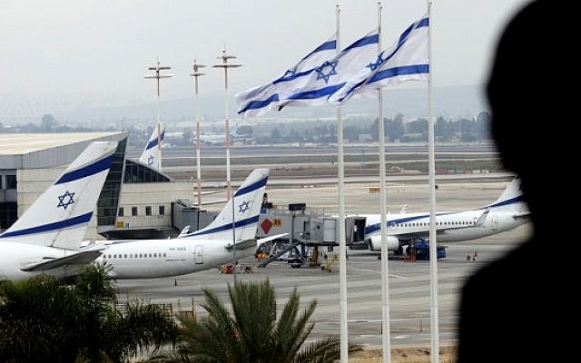 A boy looks down at El Al jets parked on the tarmac of Ben Gurion International Airport  (photo credit: Flash90)