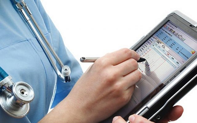 A nurse uses a digital health app (Courtesy)