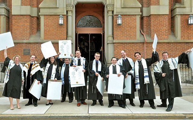 Illustrative: Newly ordained rabbis from Hebrew Union College's class of 2013 in Cincinnati celebrate with their ordination certificates outside the historic Plum Street Temple. (Janine Spang/JTA)