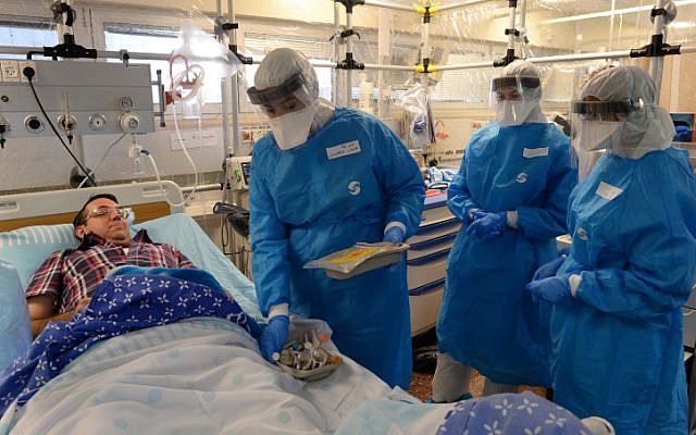 Israeli officials take part in a Ebola identification training exercise at Sheba Medical Center in Ramat Gan on October 17, 2014. (photo credit: Kobi Gideon/GPO)