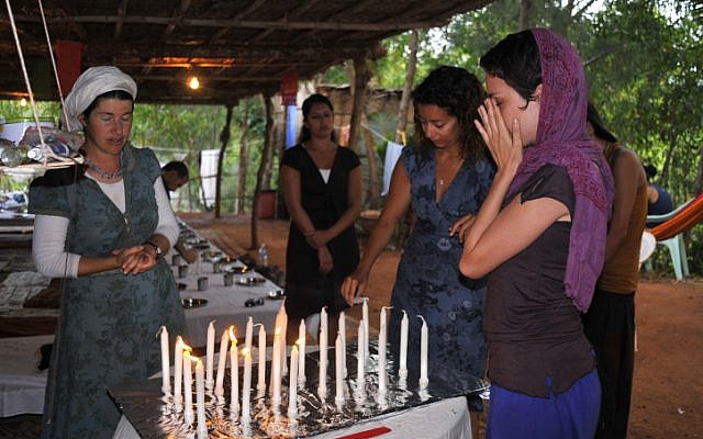 Israeli backpackers light shabbat candles in India on January 20, 2010. (Serge Attal / Flash90)