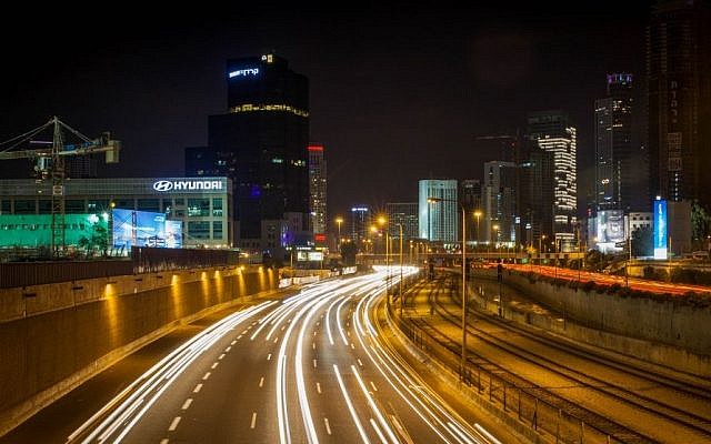 Illustrative: A long exposure photograph of traffic on the Ayalon Highway through Tel Aviv, December 19, 2015. (Esther Rubyan/Flash 90)