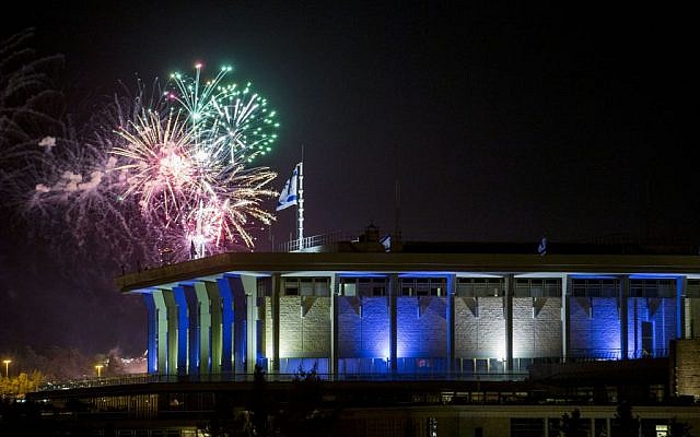 Fireworks from the Mount Herzl ceremony seen over the Knesset in Jerusalem, marking the beginning of celebrations of Israel's 68th Independence Day, May 11, 2016. (Yonatan Sindel/Flash90)
