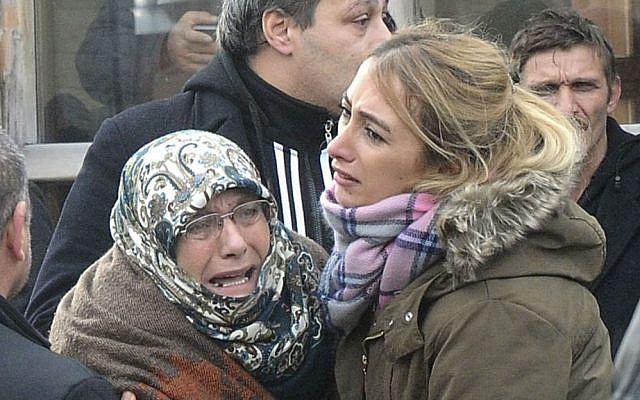 Family members of victims of an overnight terror attack at a nightclub, cry outside the Forensic Medical Center in Istanbul, Jan. 1, 2017. (Suleyman Kaya/DHA - Depo Photos via AP)