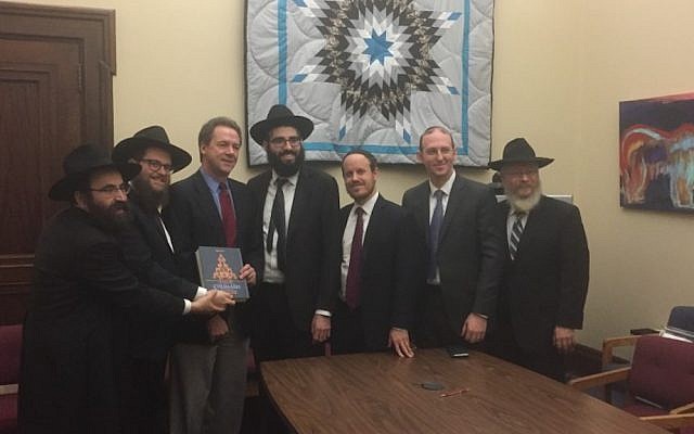 A delegation of rabbis presenting a Chumash to Montana's Governor Steve Bullock