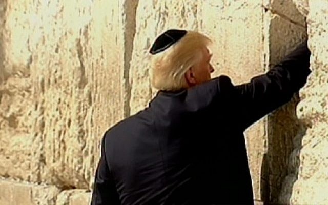 Donald Trump placing a note in the Western Wall in the Old City of Jerusalem on May 22, 2017. (screen capture: Channel 2)