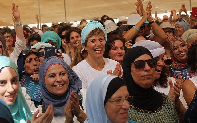 Women from the 'Women Wage Peace' movement and Palestinians take part in a march near the Jordan River, in the West Bank on Oct 8, 2017. (Flash90)
