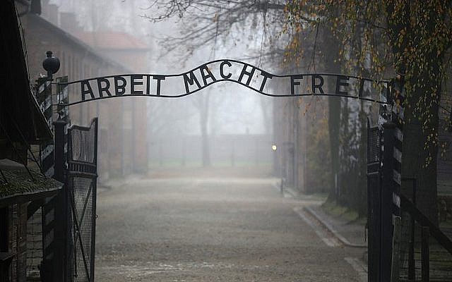 The infamous German inscription that reads 'Work Makes Free' at the main gate of the Auschwitz I extermination camp in Oswiecim, Poland, on November 15, 2014. (Christopher Furlong/Getty Images via JTA)