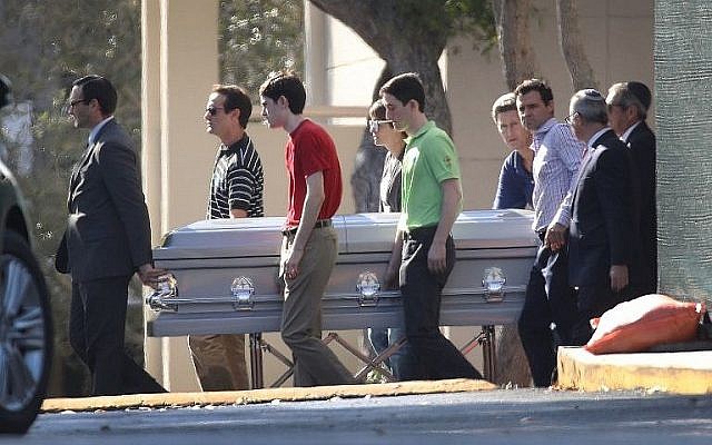 Pallbearers carry the casket of Scott Beigel, geography teacher from Marjory Stoneman Douglas High School, after a funeral service at Temple Beth-El on February 18, 2018, in Boca Raton, Florida. (Joe Raedle/Getty Images/AFP)