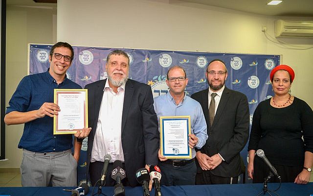 Rabbi Rafi Feuerstein (2L), Rabbi Dr. Moshe Be'eri (C) and Shai Berman, CEO of the Israel Restaurant Association (L) at a press conference on the establishment of a new Tzohar Kashrut authority in Tel Aviv, February 26, 2018. (Flash90)
