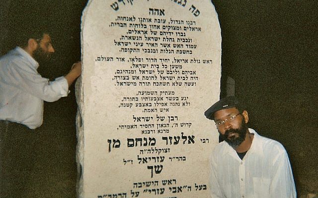 Barack O. Mandela, a fan of rappers Drake and Kanye 'Ye' West, at the grave site of Rabbi Elazar Shach in B'nai Brak, Israel. (Photo from Mr. Mandela's personal collection)