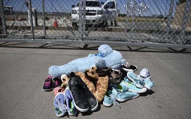 Shoes and toys for immigrant children are left at the Tornillo Port of Entry near El Paso, Texas, June 21, 2018. (Brendan Smialowski/AFP)