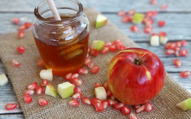 Rosh Hashanah 'foods' for a sweet new year: honey, apples, and pomegranate. (Liron Almog/Flash90)