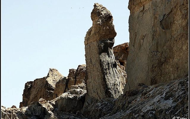 The lone pillar on Mount Sodom has been associated with Lot's wife who was turned into a pillar of salt when she turned back to look at the destroyed city of Sodom.