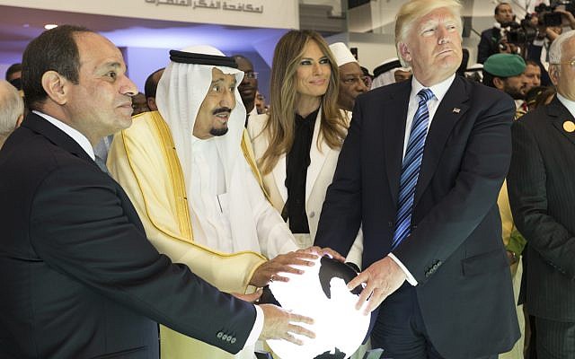 President Donald Trump and First Lady Melania Trump join King Salman bin Abdulaziz Al Saud of Saudi Arabia, and the President of Egypt, Abdel Fattah Al Sisi, Sunday, May 21, 2017, to participate in the inaugural opening of the Global Center for Combating Extremist Ideology. They have their hands on an orb, which some critics mocked them for. (Official White House Photo by Shealah Craighead via Wikipedia )