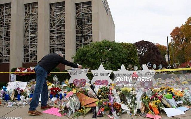 PITTSBURGH, PA - OCTOBER 31:  Mourners visit the memorial outside the Tree of Life Synagogue on October 31, 2018 in Pittsburgh, Pennsylvania. Eleven people were killed in a mass shooting at the Tree of Life Congregation in Pittsburgh's Squirrel Hill neighborhood on October 27. (Photo by Jeff Swensen/Getty Images)