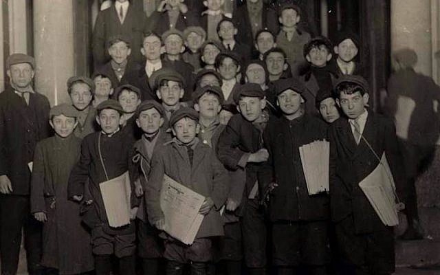 Newsboys for the Forward wait for their copies in the early morning hours, March 1913. (Lewis Hine/Wikimedia Commons)
