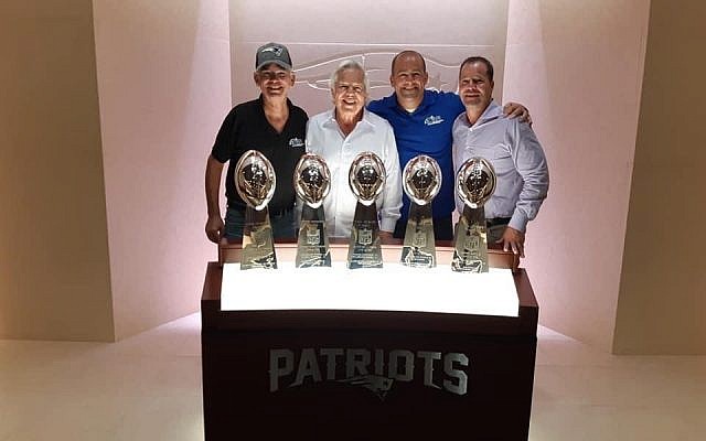 The Patriots' 5 Lombardi trophies at Foxboro Stadium. (from left) Steve Leibowitz, Robert Kraft, Yonah Mishaan, Dan Kraft. (courtesy)