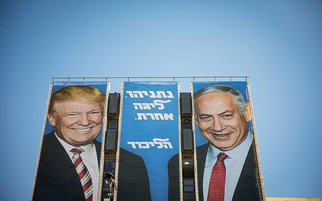 An election campaign billboard of the ruling Likud party reading 'Netanyahu is a different league' shows Israeli Prime Minister Benjamin Netanyahu (R) and US President Donald Trump (L)