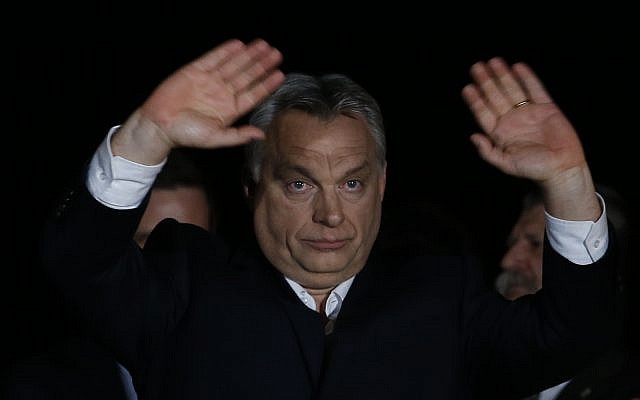 Hungarian Prime Minister Viktor Orban greets his supporters in Budapest, Hungary, April 8, 2018. (AP Photo/Darko Vojinovic)