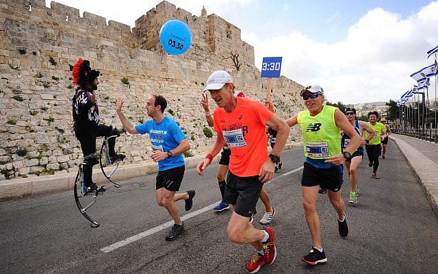Thousands of runners take part in the 2018 international Jerusalem Marathon in Jaffa Gate in Jerusalem Old City on March 9, 2018. Photo by Mendy Hechtman/Flash90