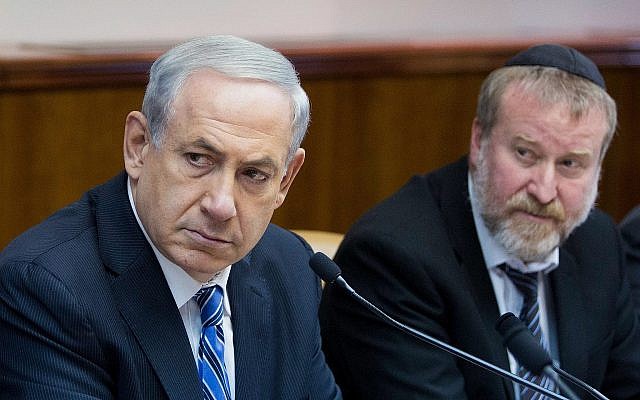 Prime Minister Benjamin Netanyahu (left) and then-cabinet secretary Avichai Mandelblit at a weekly cabinet meeting at the Prime Minister's Office in Jerusalem on February 2, 2014. (Yonatan Sindel/Flash90)
