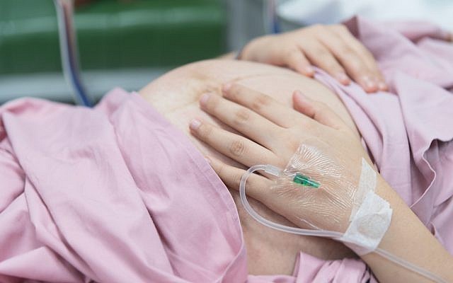 Illustrative. A pregnant woman with an IV solution. (iStock)