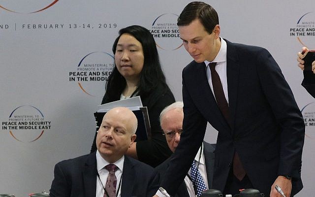 Jared Kushner, center, and Jason Greenblatt, left, attend the opening session of a Middle East peace conference in Warsaw, Poland, February 14, 2019. (Sean Gallup/Getty Images via JTA)