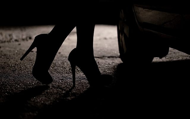 Illustrative. A woman's high-heeled feet, in silhouette. (iStock)